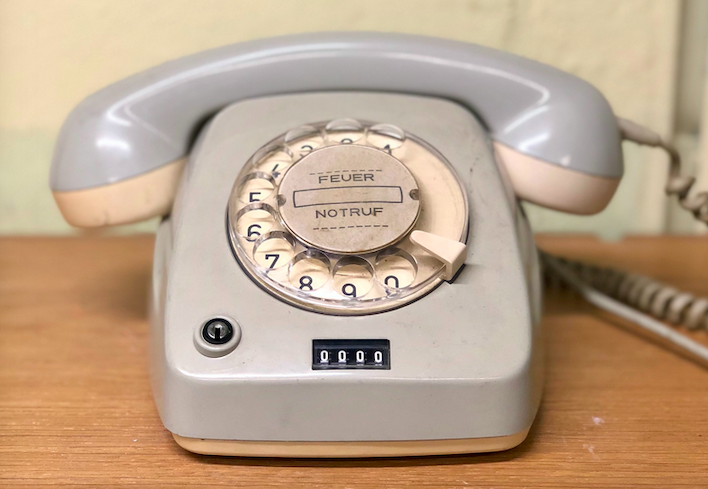 grey rotary telephone