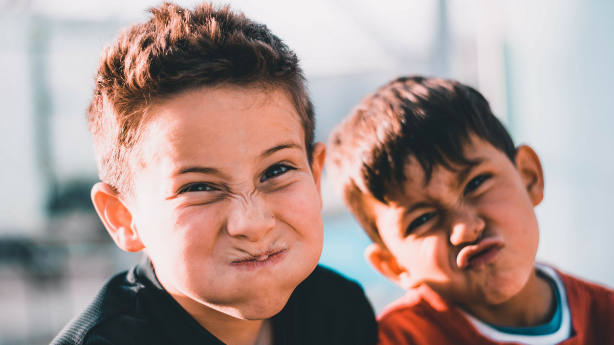 Two boys making "yuck" faces - image by Austin Pacheco from Unsplash
